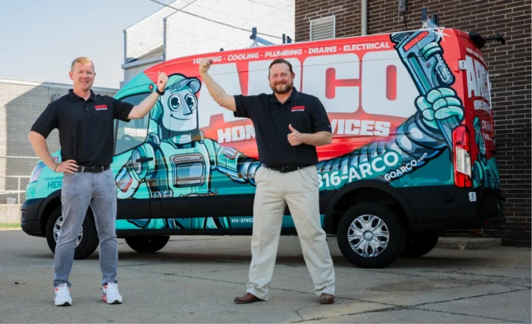 Two men stand in front of a colorful van with "Arco Home Services" branding, featuring an illustrated robot.